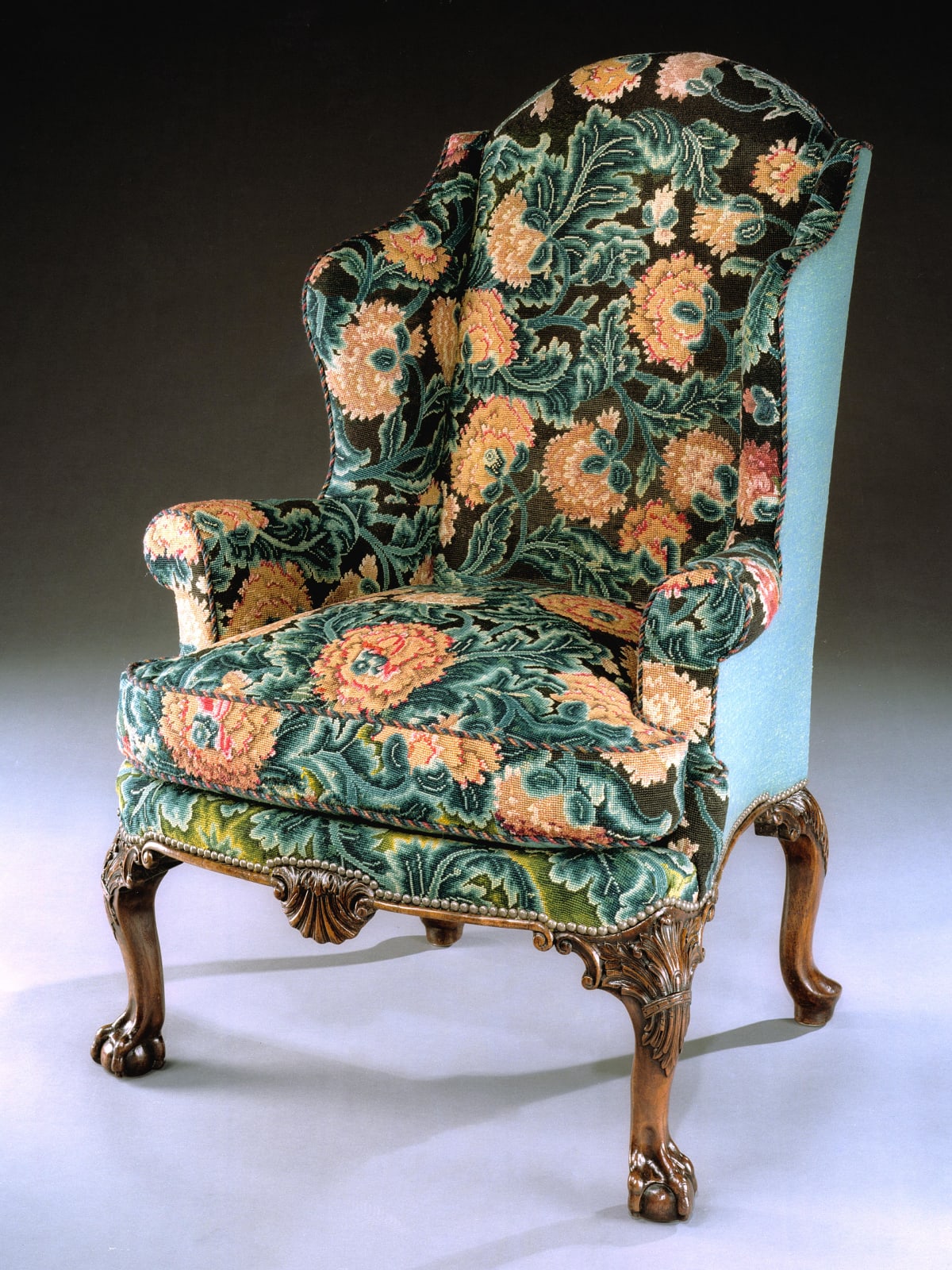 A GEORGE II WALNUT WING ARMCHAIR, English, circa 1735