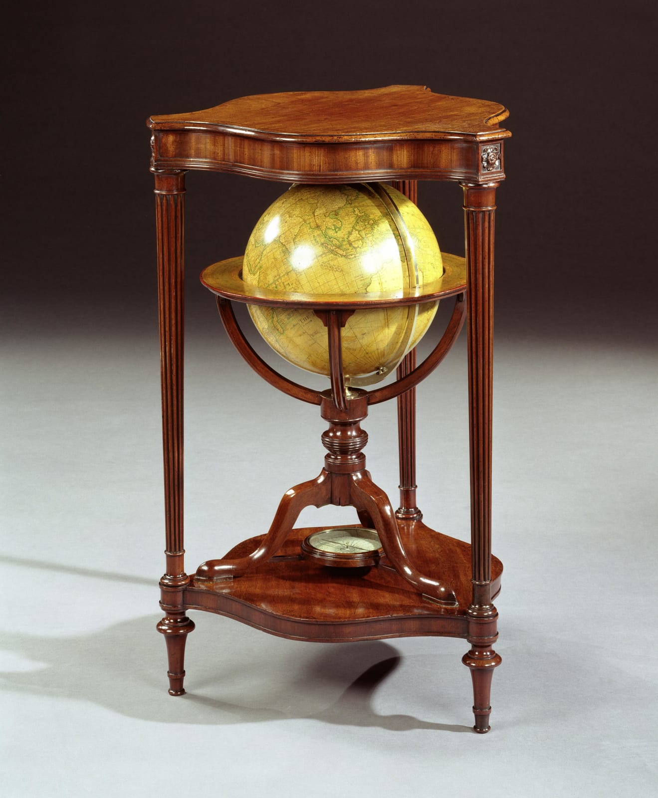 A PAIR OF GEORGE III GLOBES BY DUDLEY ADAMS, The terrestrial globe 1816  The celestial globe dated 1811  The stands English, circa 1800