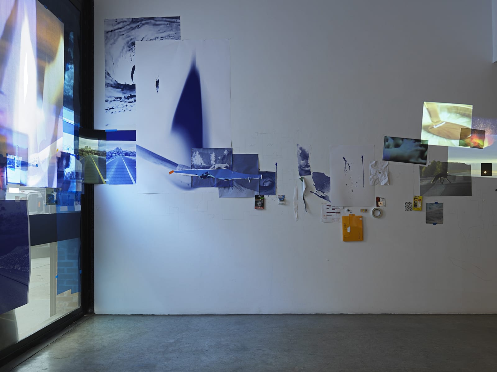 Sarah Sze, installation view of video projections and images on wall