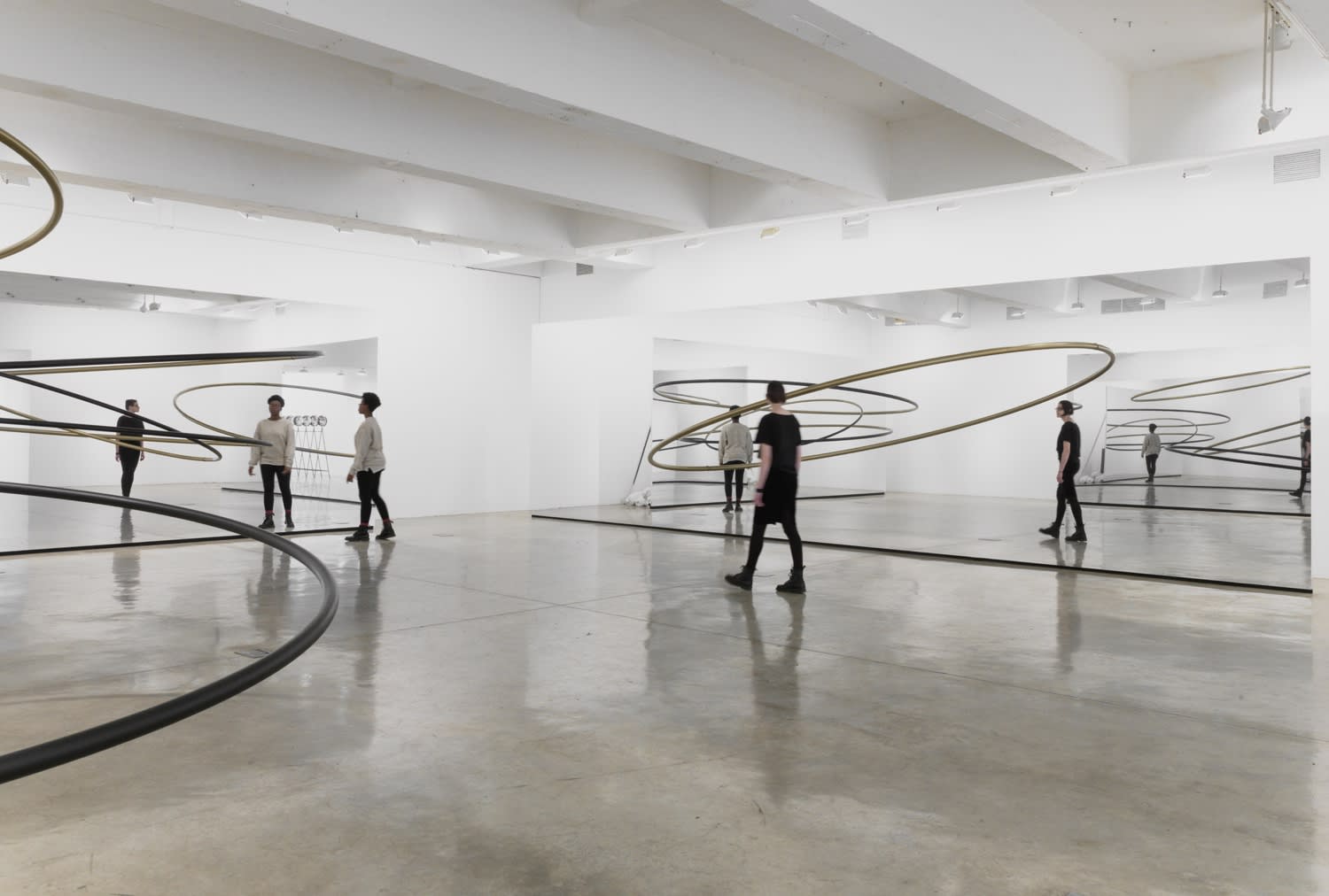 Image of Eliasson, mirrored panels reflecting circular sculptures