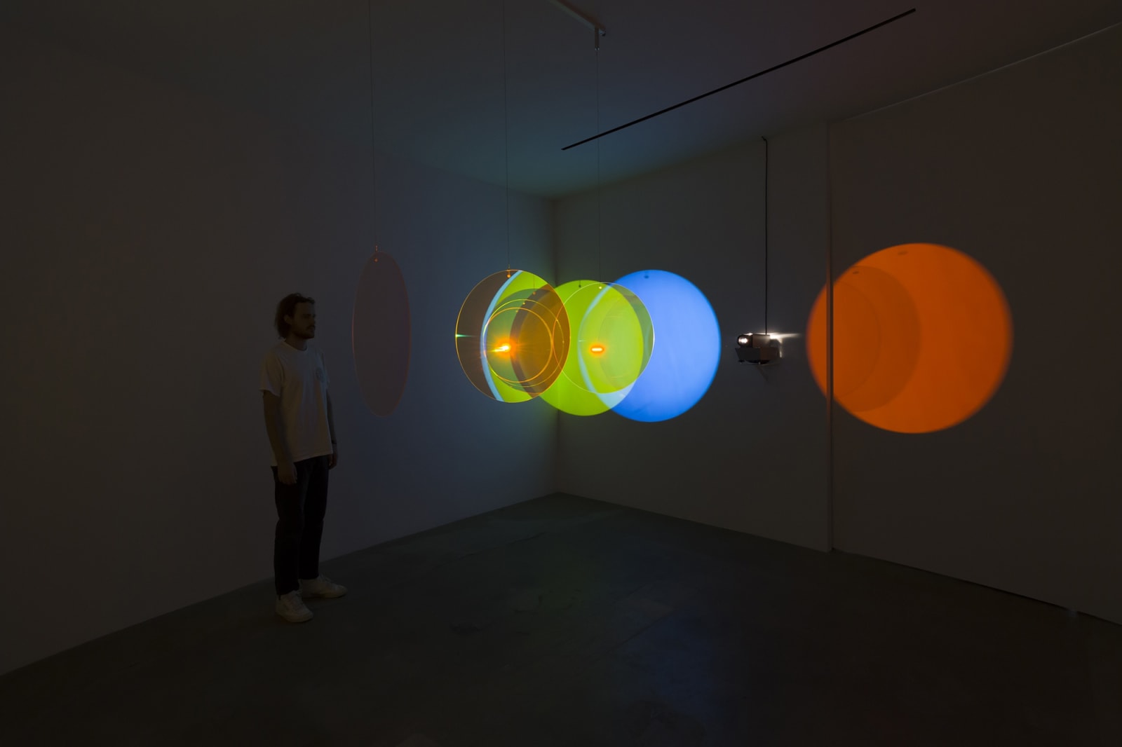 image of eliasson, lens flare installation in dark room