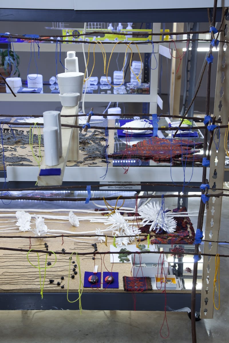 sarah sze installation view of large structure with dimmed lights