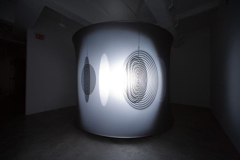 Eliasson dark room with shadows turning disc