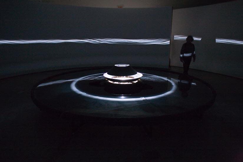 Eliasson dark room installation with light wave