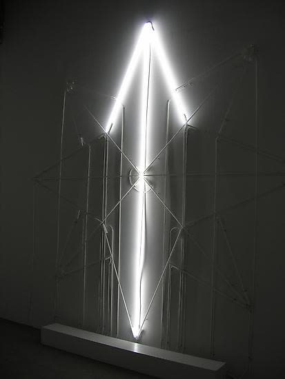 Eliasson dark room with neon arrow