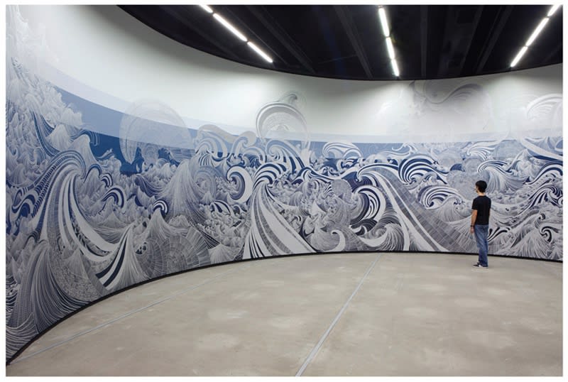 painting installation of waves in circular room