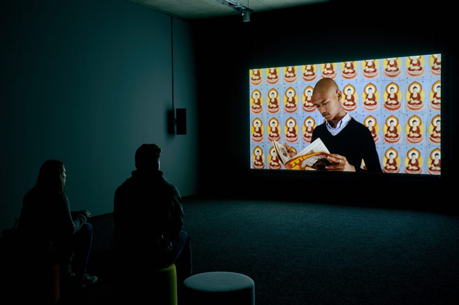 Image of Phil Collins installation with video still