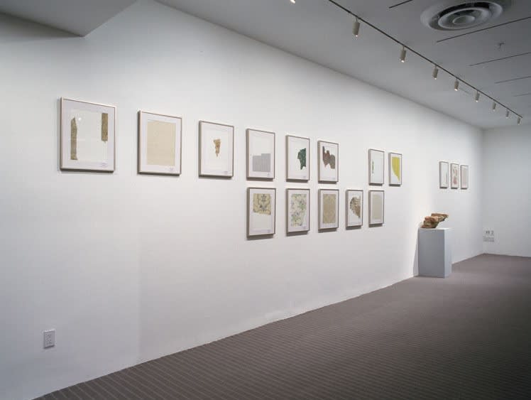 image of installation with cabinet and sculptures at MoMA