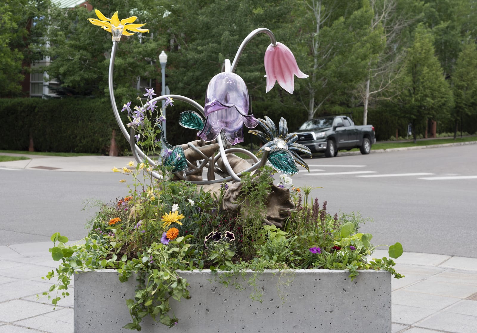 Image of Kelly Akashi bronze hand sculpture, view from the back with flowers