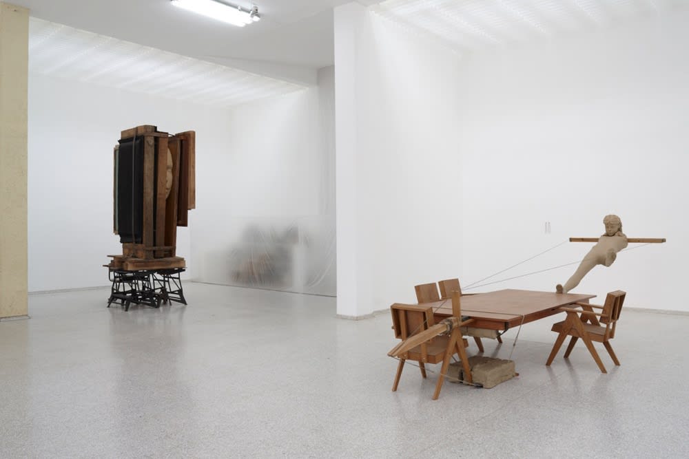 image of Mark Manders tables and chairs with clay figure at Venice Biennale