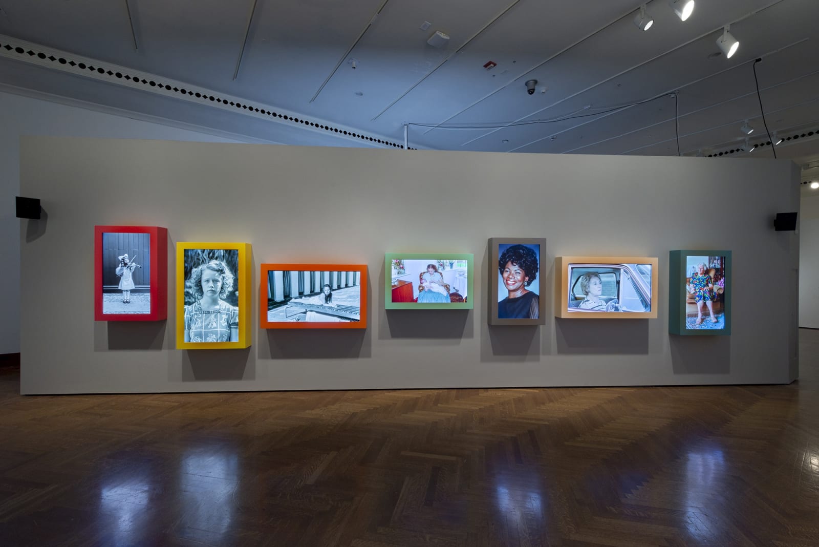 Image of Wearing installation, moving photographs in a row