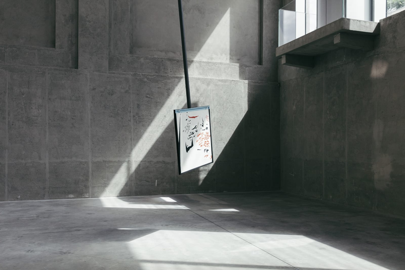 image of a large pendulum with a drawing on it