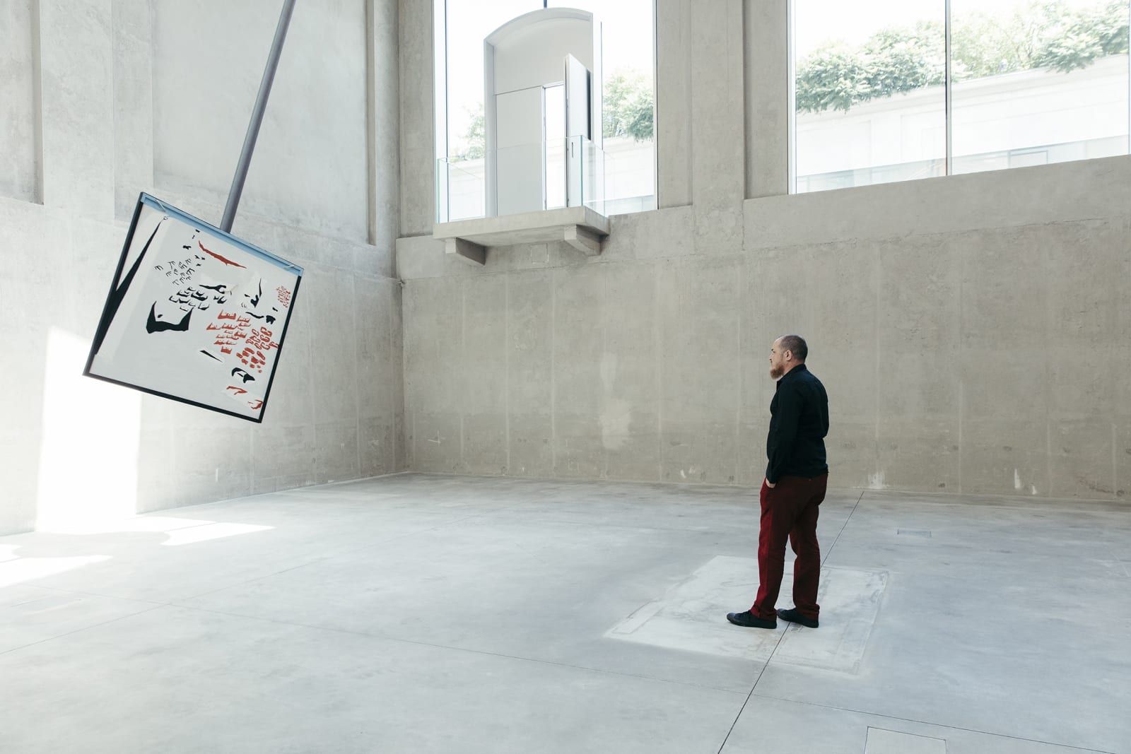 image of a large pendulum with a drawing on it