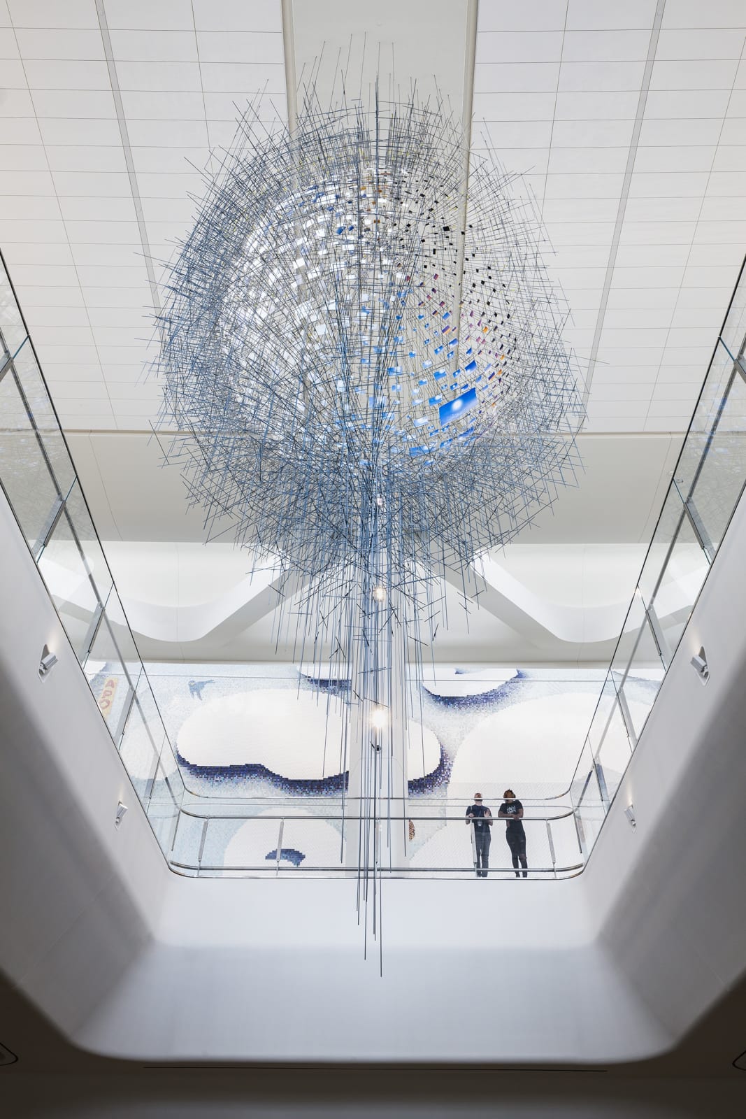 image of large Sarah Sze installation - small photos of the sun arranged in a sphere