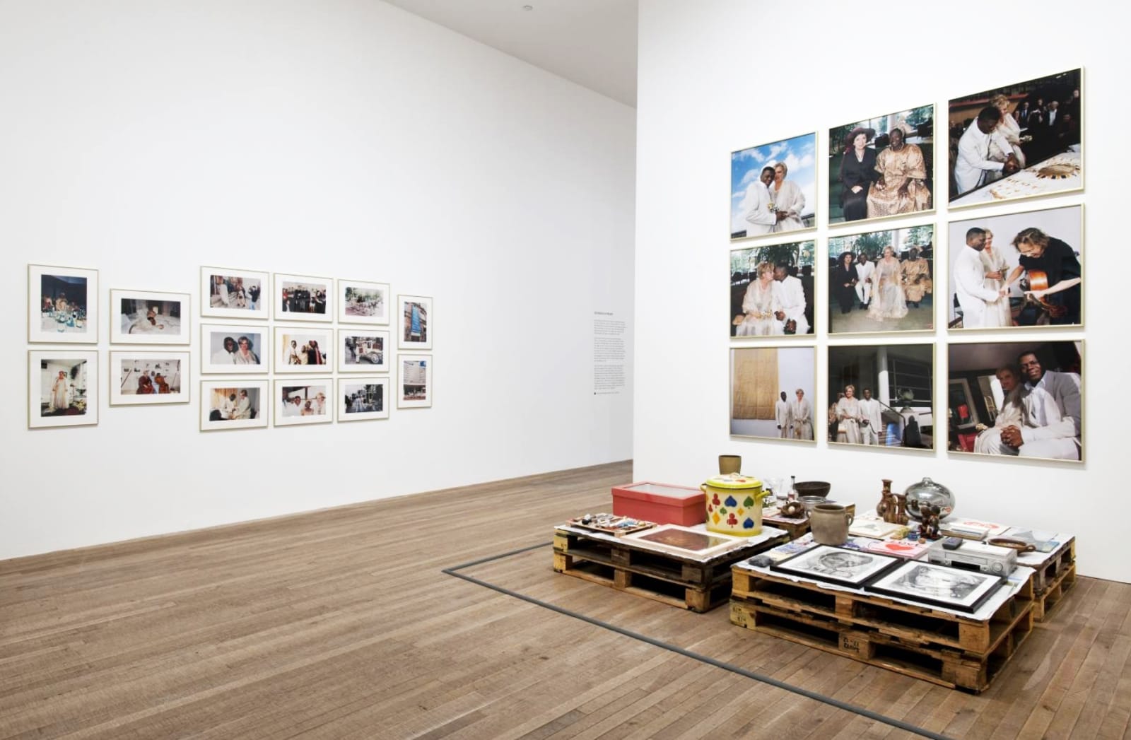 installation image of Meschac Gaba works at Tate, photographs on the wall