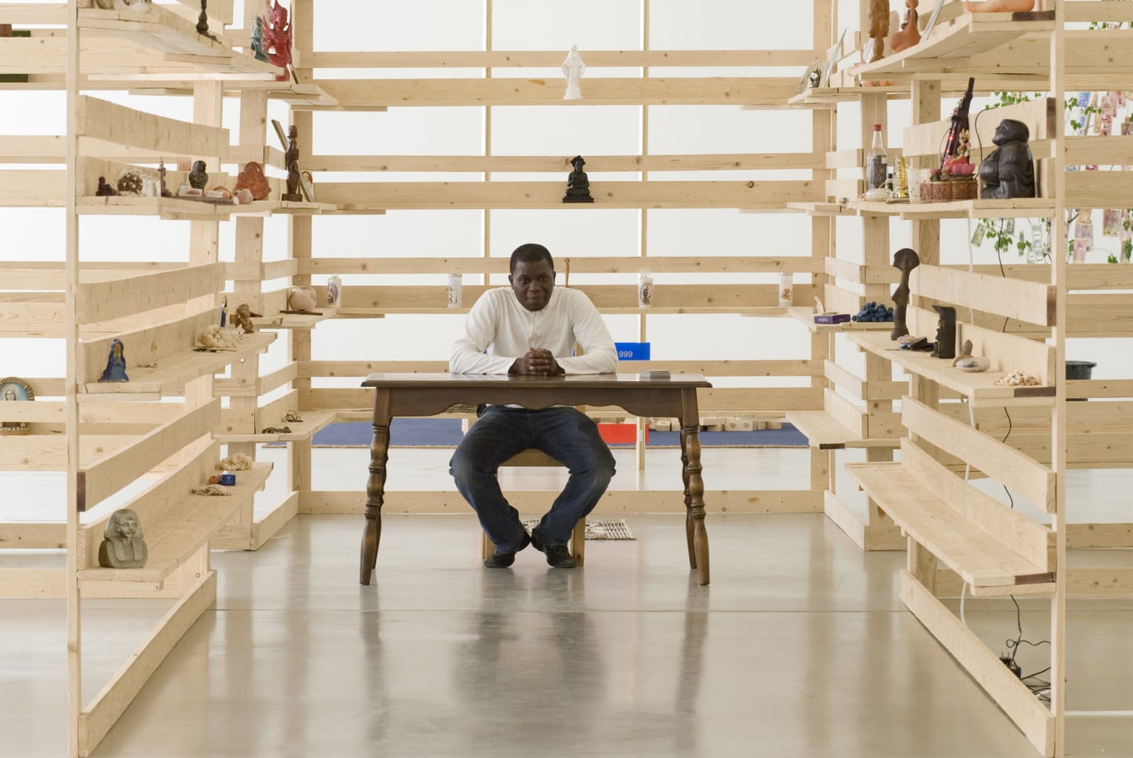 Meschac Gaba sitting at table