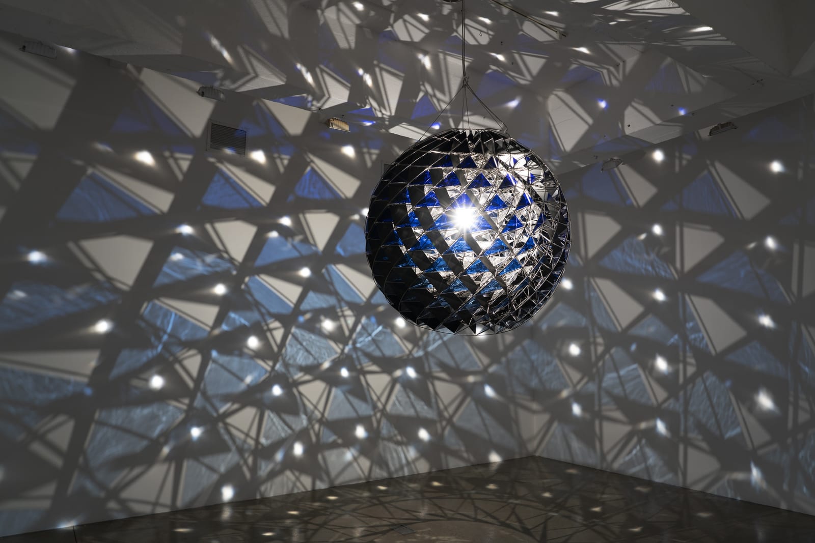 image of group show installation view, eliasson light sculpture