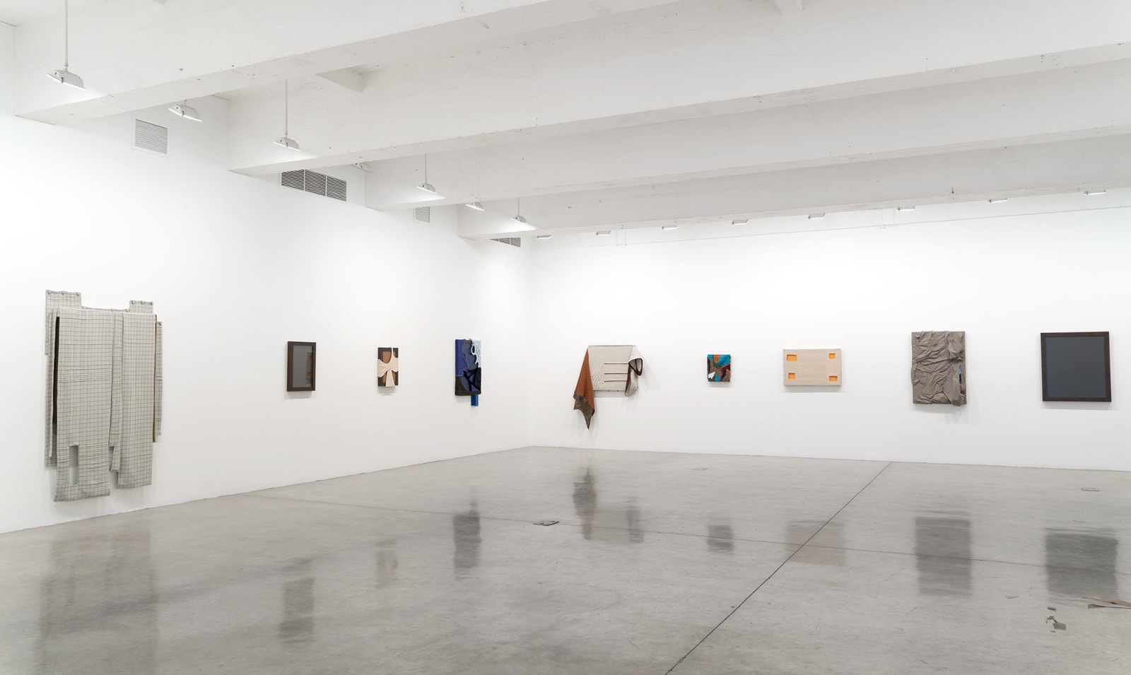 Laura Lima tailor shop install photo - portraits