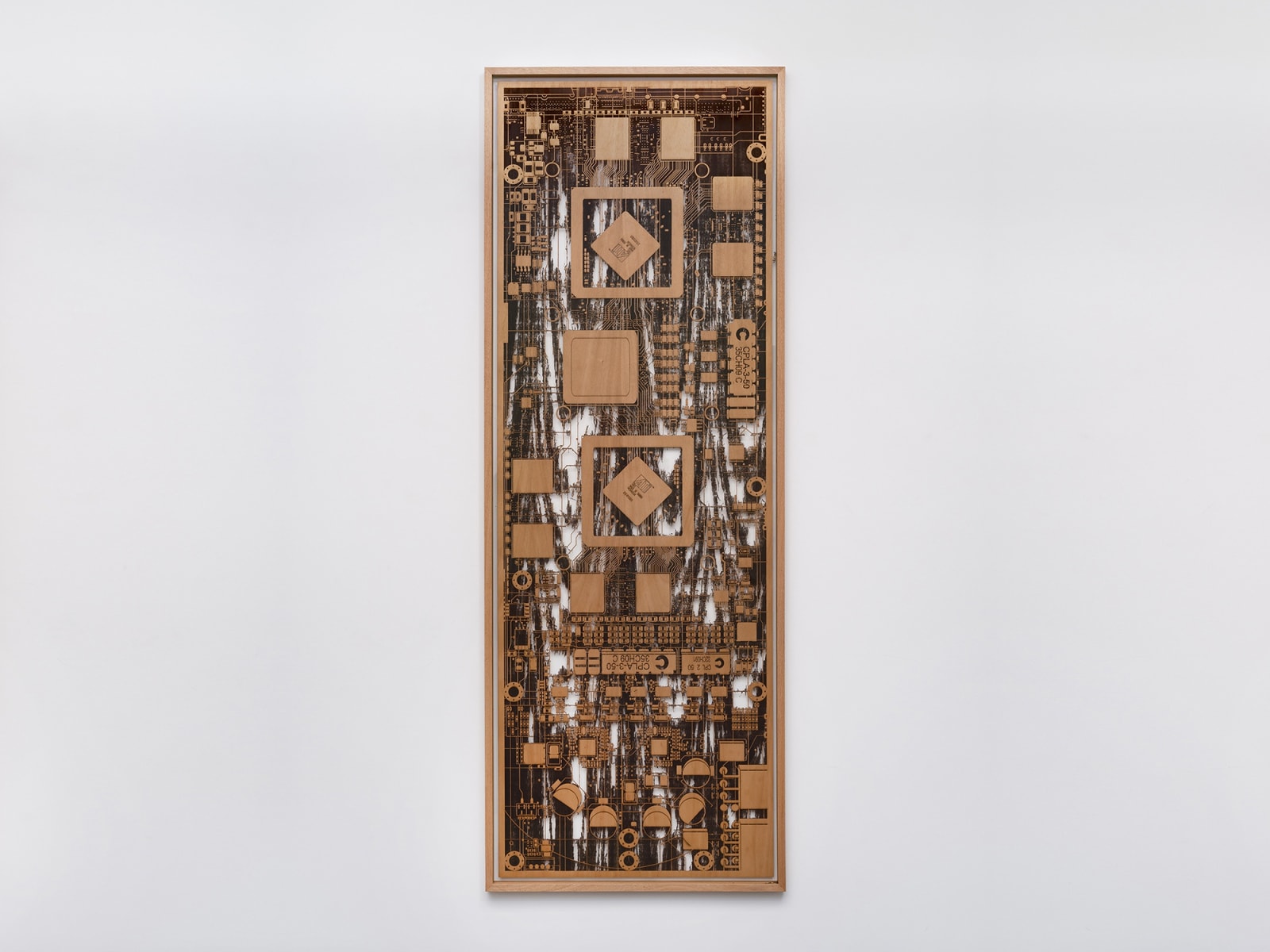 Wooden sculpture on white wall
