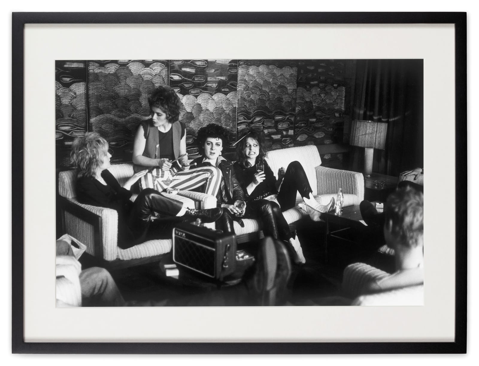 <div class="artist">Caroline Coon</div><div class="title_and_year"><span class="title">The Slits. Viv Albertine (guitar), Palmolive (drummer), Tessa Pollitt (bass) and Ari-up (lead singer) in the Post House Lobby, Cardiff, before going to the Top Rank gig on The Clash ‘White Riot’ tour</span><span class="year">, 1977</span></div>