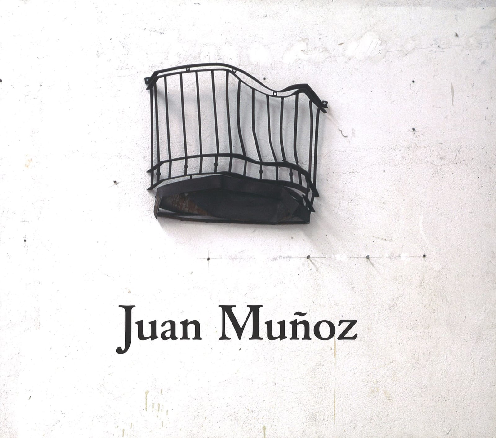 A catalog for Juan Munoz with a photo of a run-down balcony.