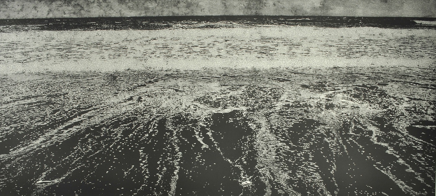 An intricately detailed print in black and white by Trevor Price of a wave surging out to sea, the viewpoint towards the sea.