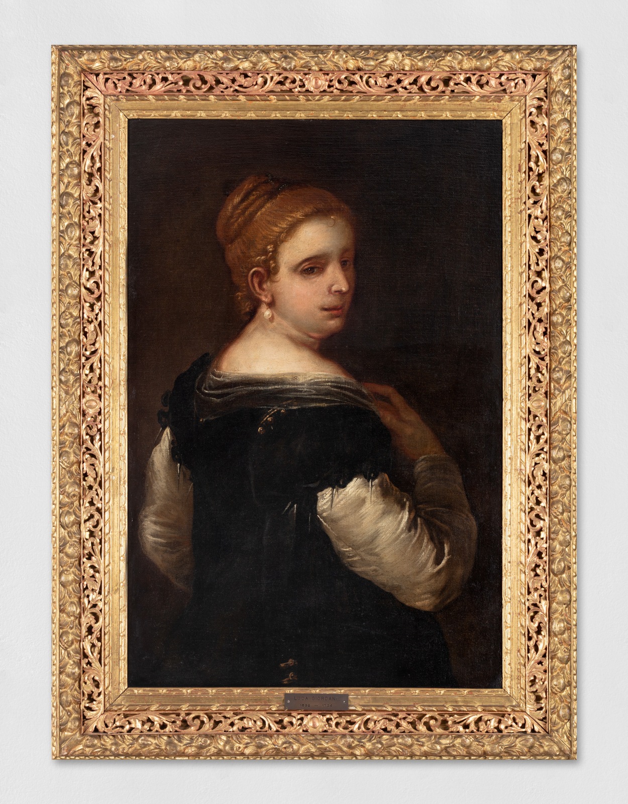 An oil painting of a portrait of a young woman.