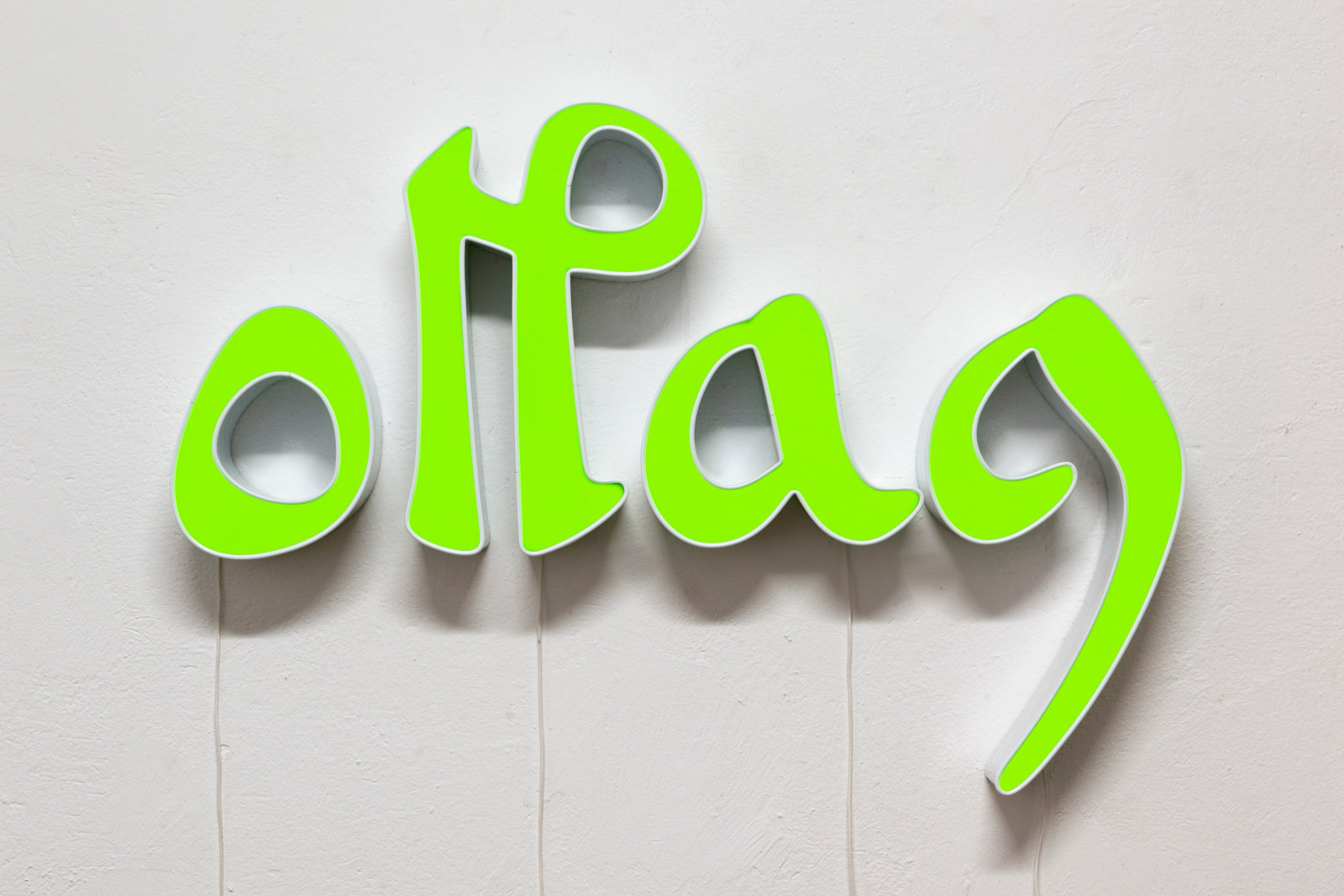 A neon sign in green letters on a white background.