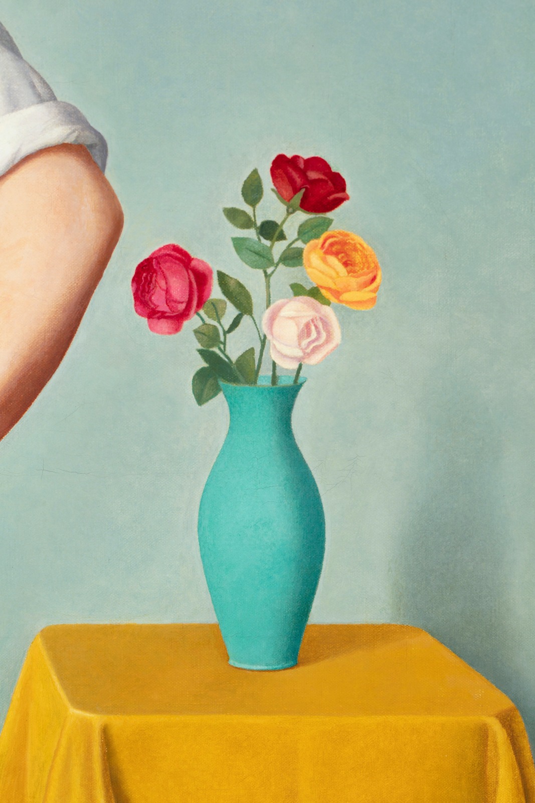 A detail of a blue vase of flowers.