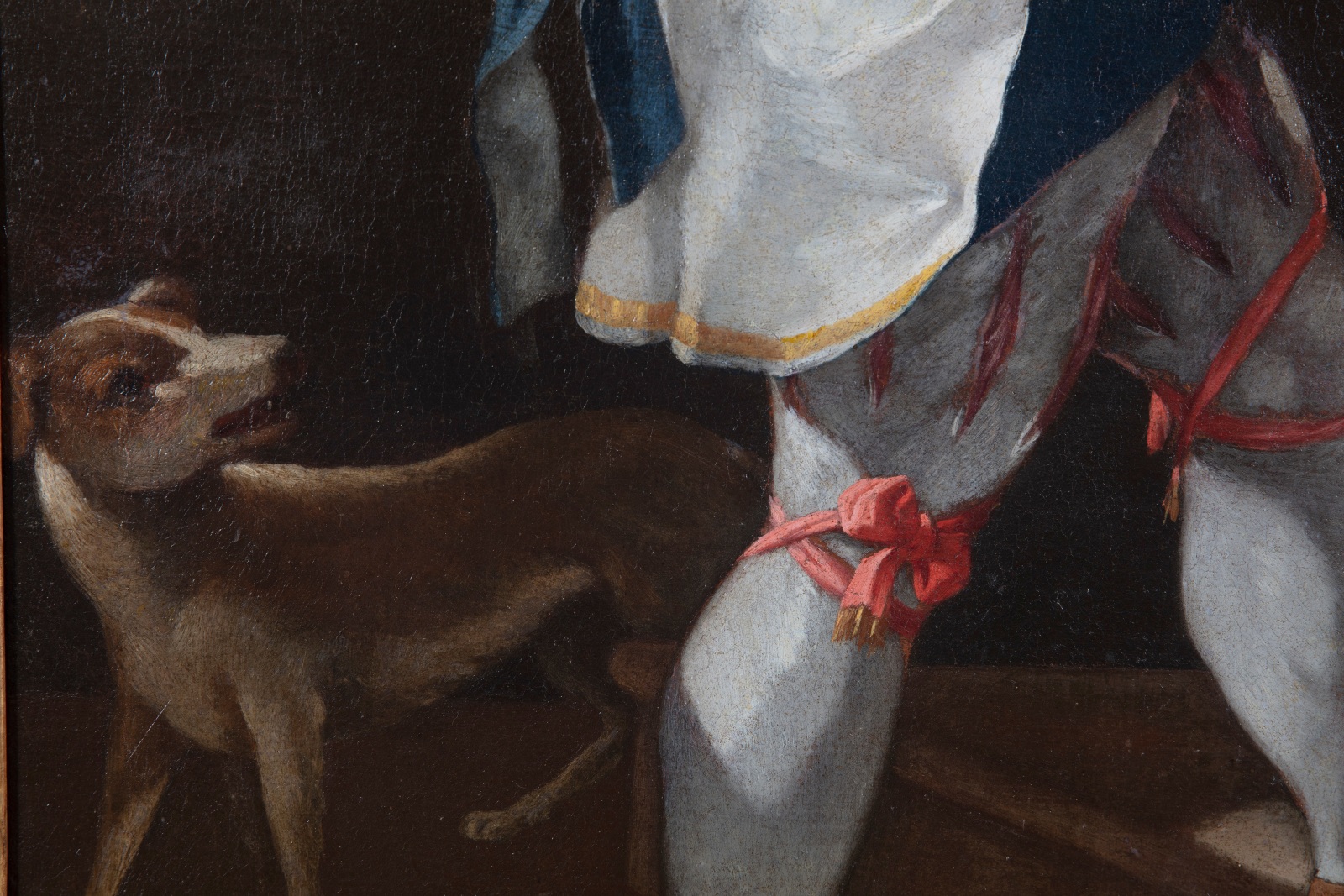 Detail of an oil painting of a young boy with a fruit platter.