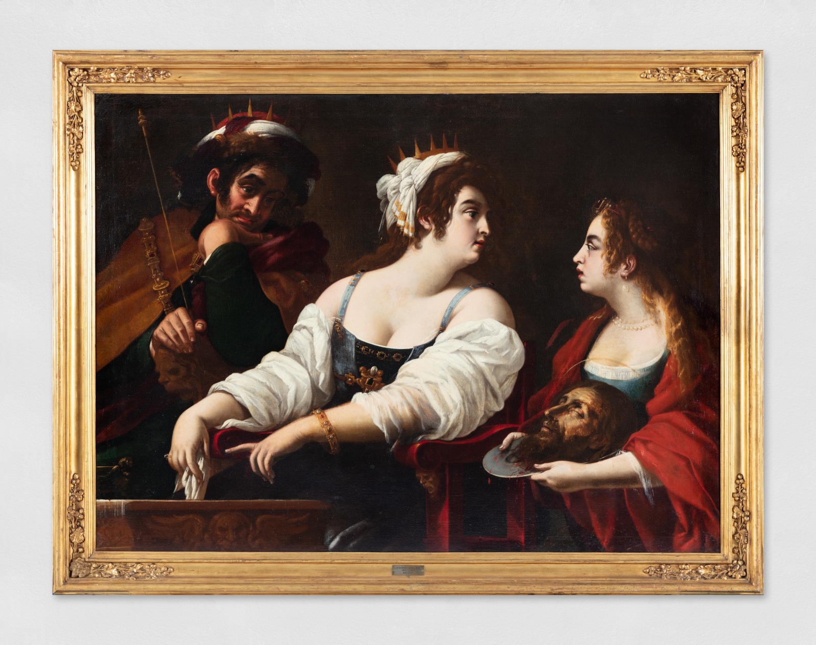 Oil painting of the biblical event from the New Testament, the story of the beheading of John the Baptist where the severed head is presented on a silver platter to Herod Antipas, ruler of Galilee under the Roman Empire who ordered his execution.