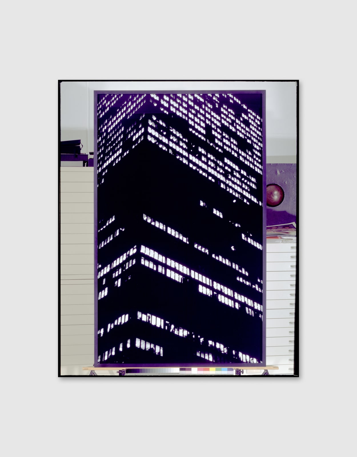 Print of an illuminated skyscraper