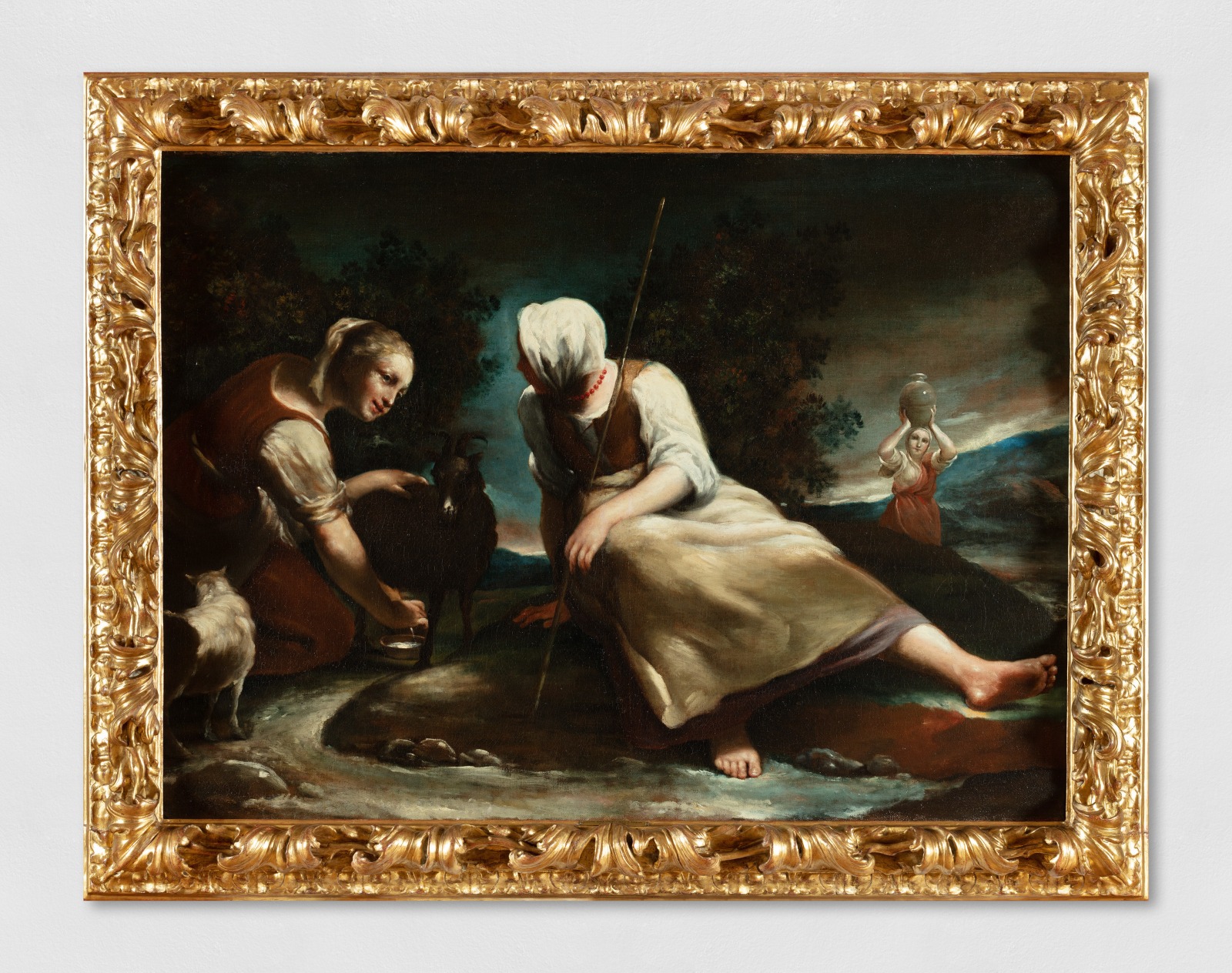 Painting depicting two shepherdesses sitting on a meadow, intent on stroking two baby goats. In the background of the painting is a third female figure with a jug on her head.