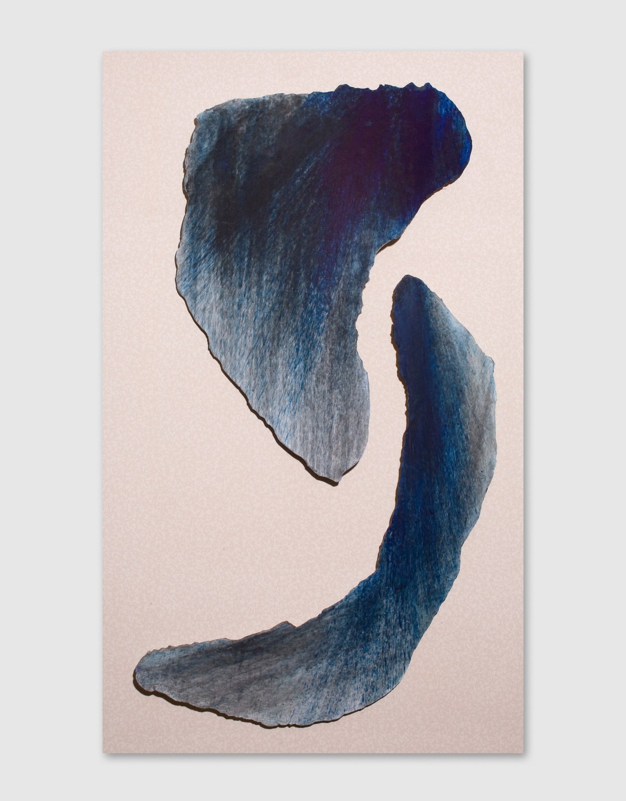 Abstract figure composed of two grey-blue elements.