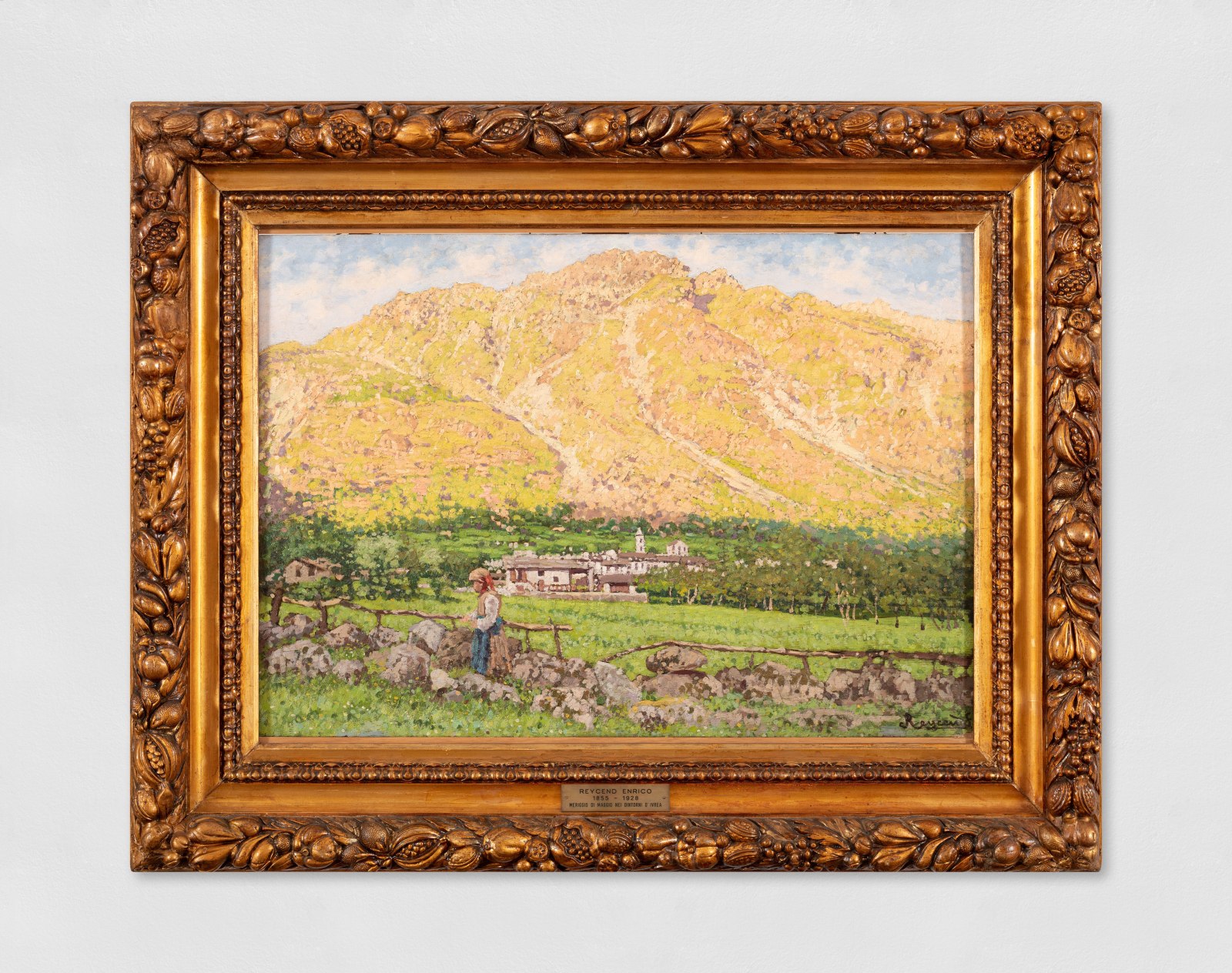 A landscape oil painting of a day at noon in May around Ivrea, Italy, showing a mountain, village and figure in the field.
