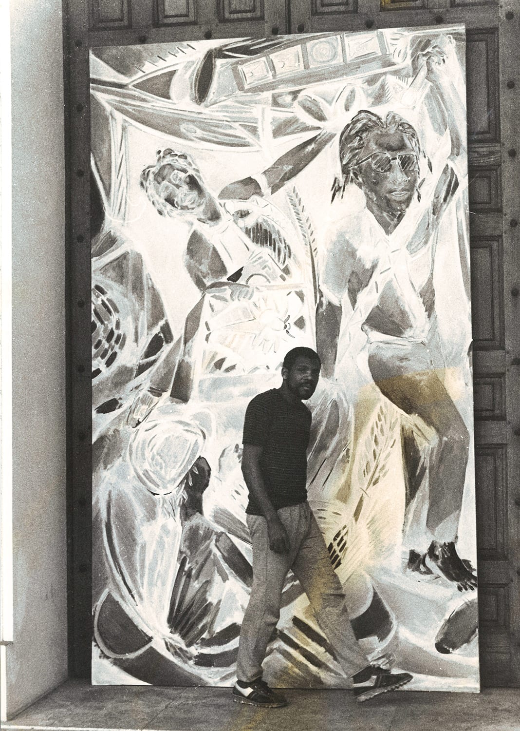 <p><span>Portrait of Denzil Forrester standing in front of ‘Wolf Singer’ (1984).</span></p>