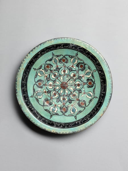 <span class="title"><em>Mināʾi dish with floral interlace over turquoise glaze, Iran, probably Kashan</em>, c. 1180-1200</span>