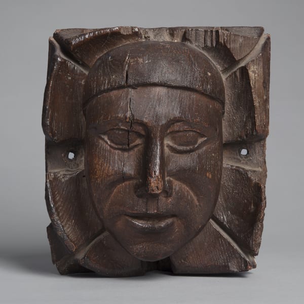 <span class="title"><em>A carved oak boss with the head of a man amongst foliage</em>, second half of the 15th century</span>