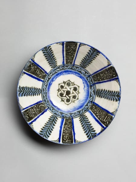 <span class="title"><em>A bowl with radial decoration and poetic inscriptions, Iran, probably Kashan</em>, c. 1200-1220</span>