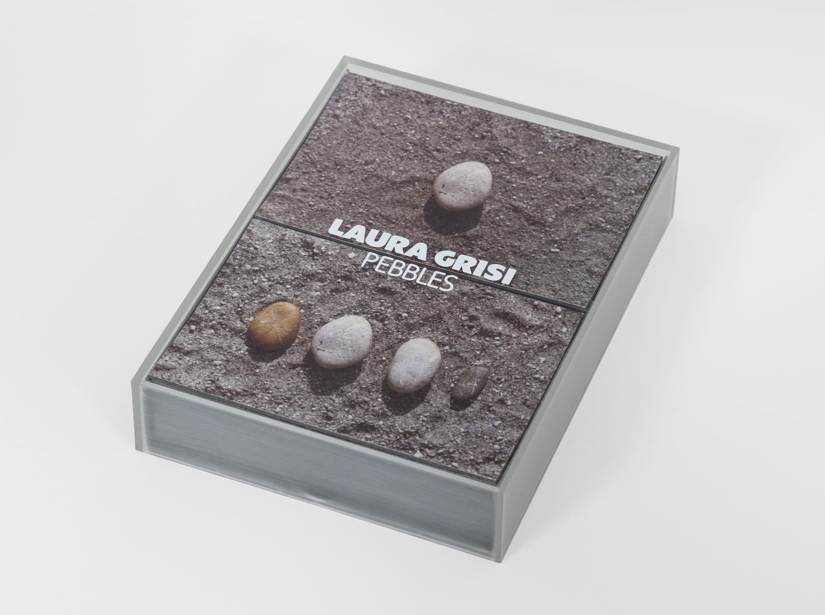 Laura Grisi Pebbles, 1973 Gelatin silver print, 33 photographs, mounted on card, in acrylic box Photographs: 7 1/4 x 5...