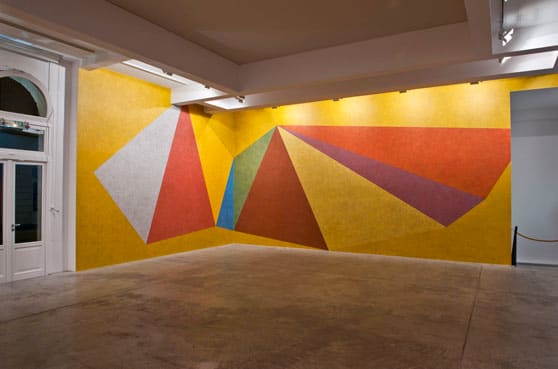 Sol LeWitt Wall Drawing #457: Double asymmetrical pyramids with color ink washes superimposed, 1985