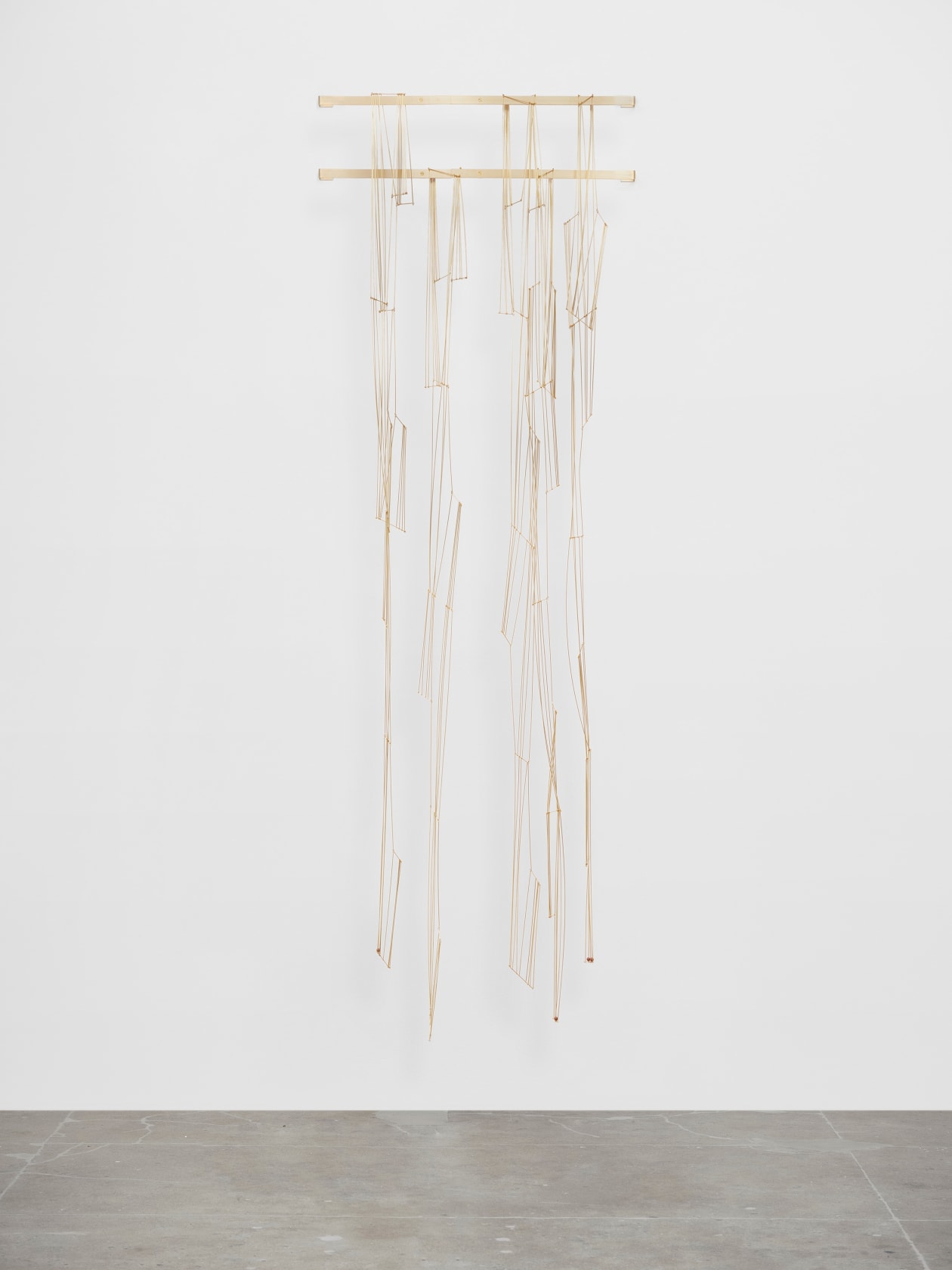 Leonor Antunes discrepancies with W.W. #7, 2025 Brass, acrylic beads Dimensions variable Laid flat dims left to right: a. 170x5'...