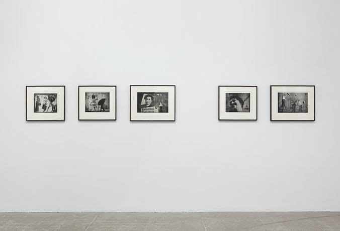 Gallery view of five framed black and white prints of abstract portraiture.