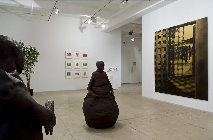 An installation view of two sculptures, 9 framed photographs, a plant and a large canvas in a white gallery space.