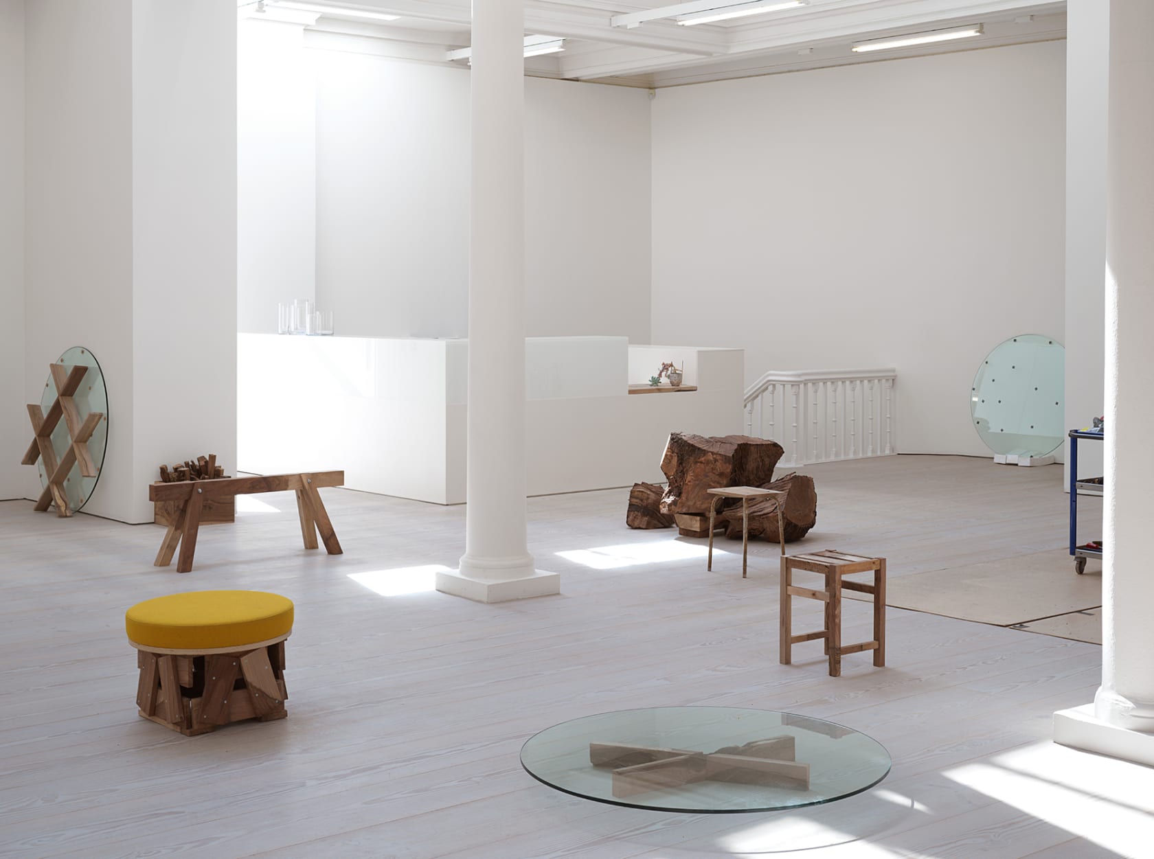 Gallery filled with various wooden furniture. 