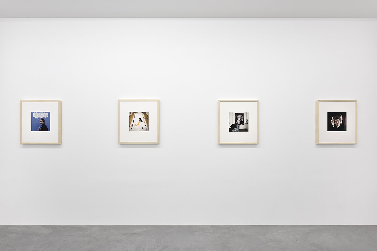 4 framed artworks hang in a gallery.