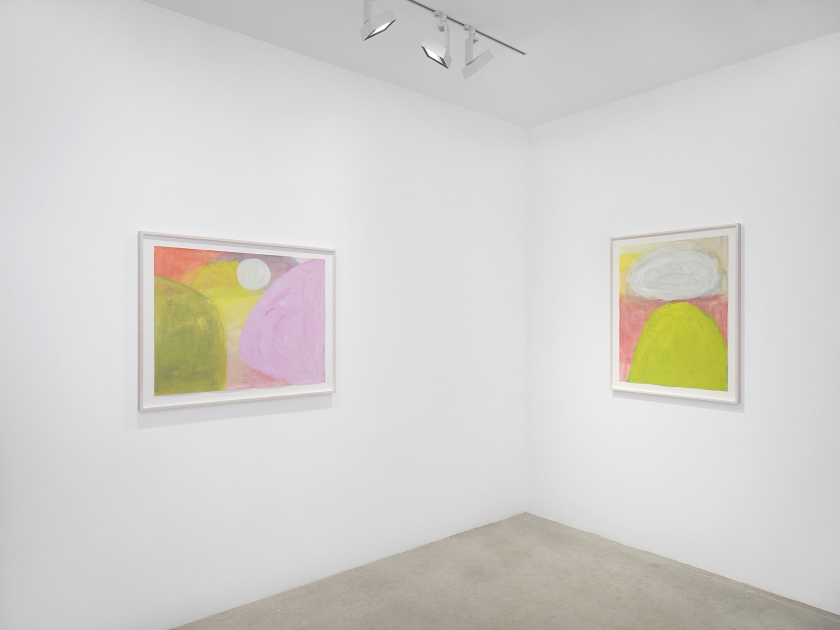 Two colorful landscape paintings in white frames by Jongsuk Yoon in white gallery space