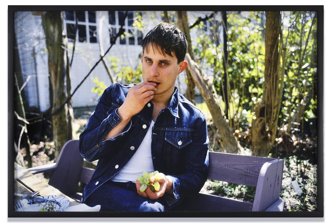 Nan Goldin Clemens Eating Grapes Under My Arbor, Sag Harbor, NY., 2001 Archival pigment print 50.8 X 76.2 cm; with...