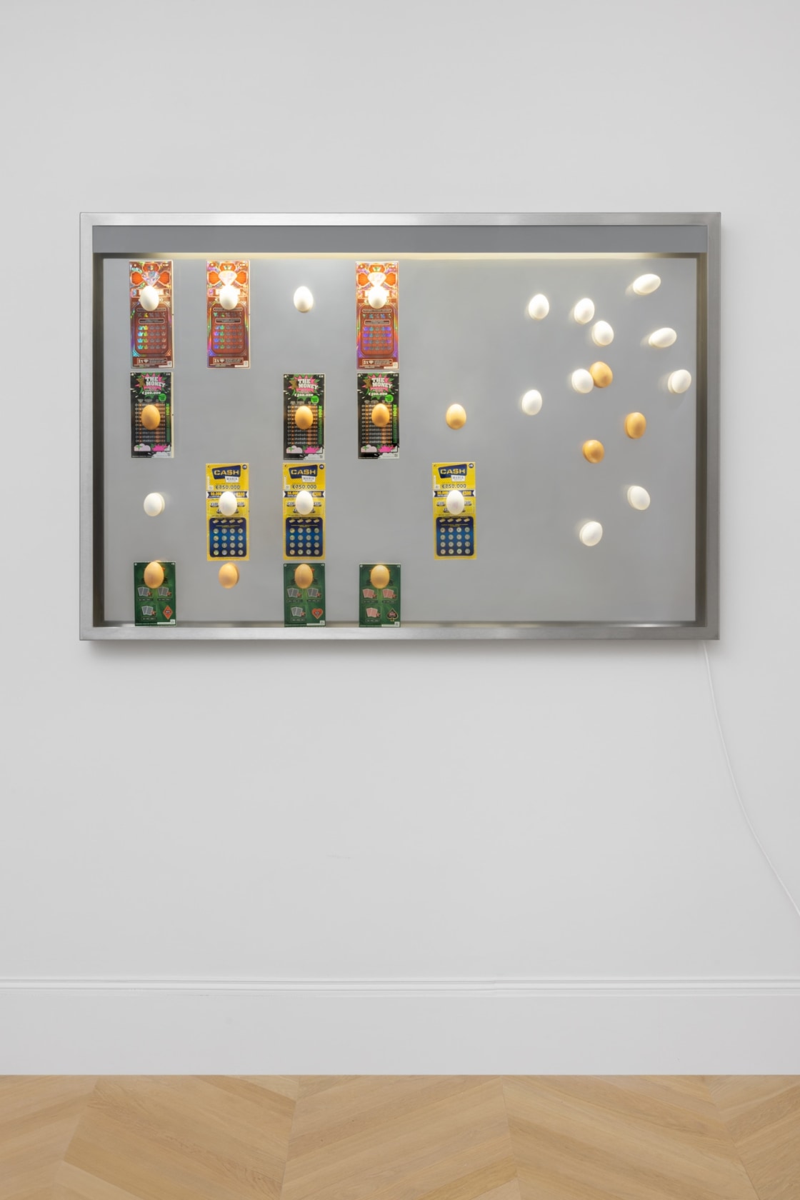 Gabriel Kuri untitled horizontal scratch lotto and eggs vitrine, 2023