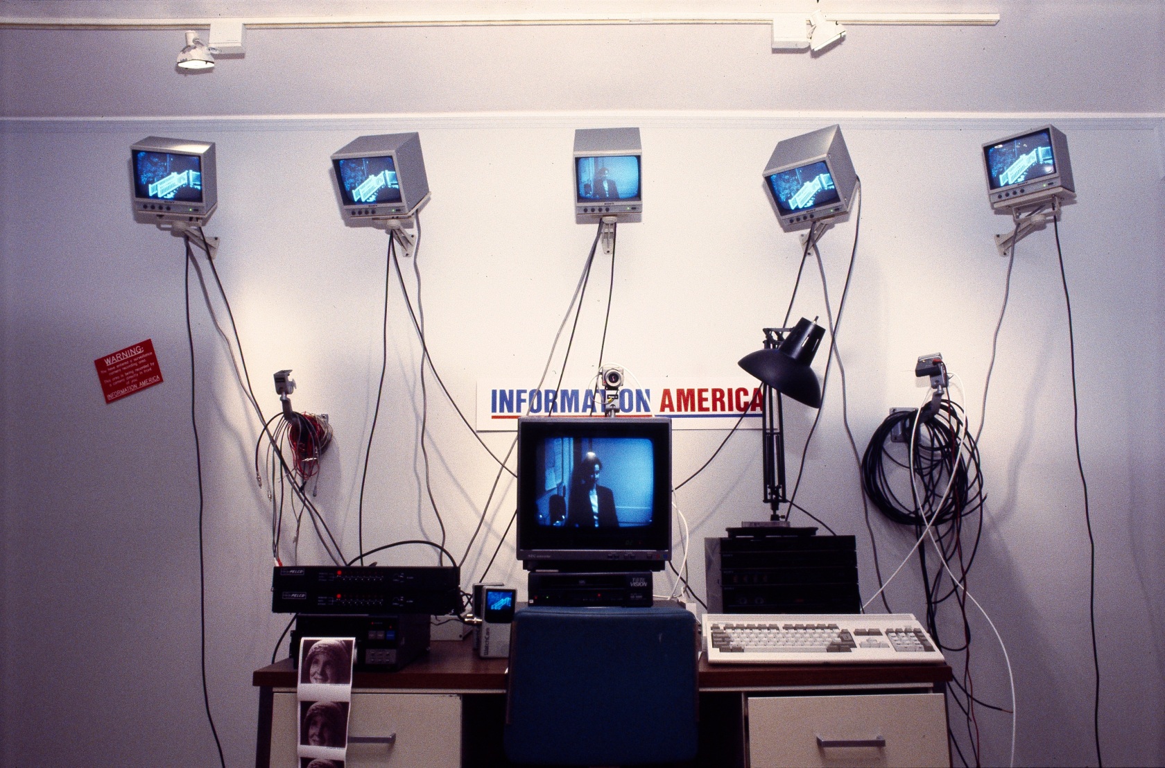 Julia Scher, Information America, 1995